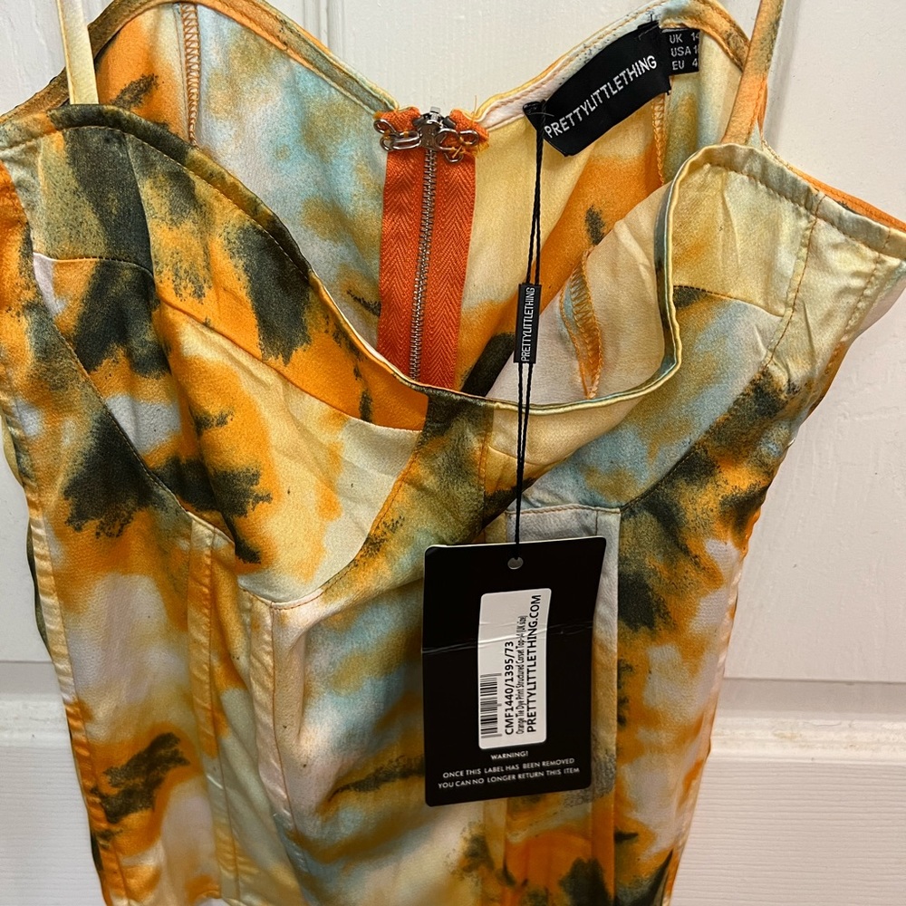 Yellow but has more orange, never worn